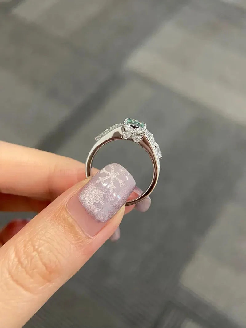 Green radiant diamond engagement ring