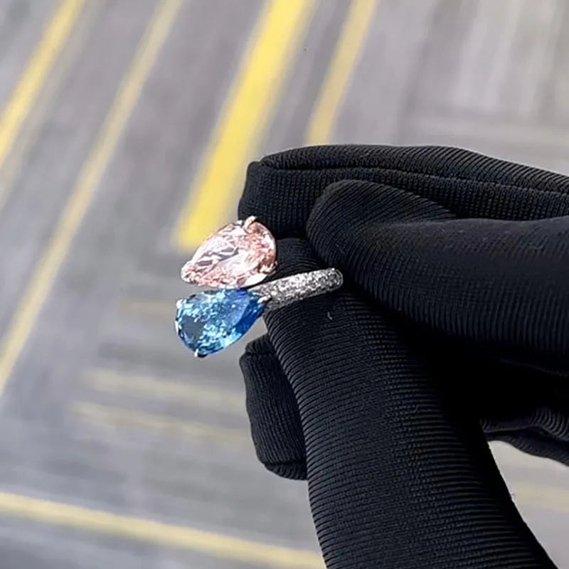 Pear-shaped pink and blue diamond engagement ring