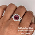 Red lab-created ruby ring with three-arm setting