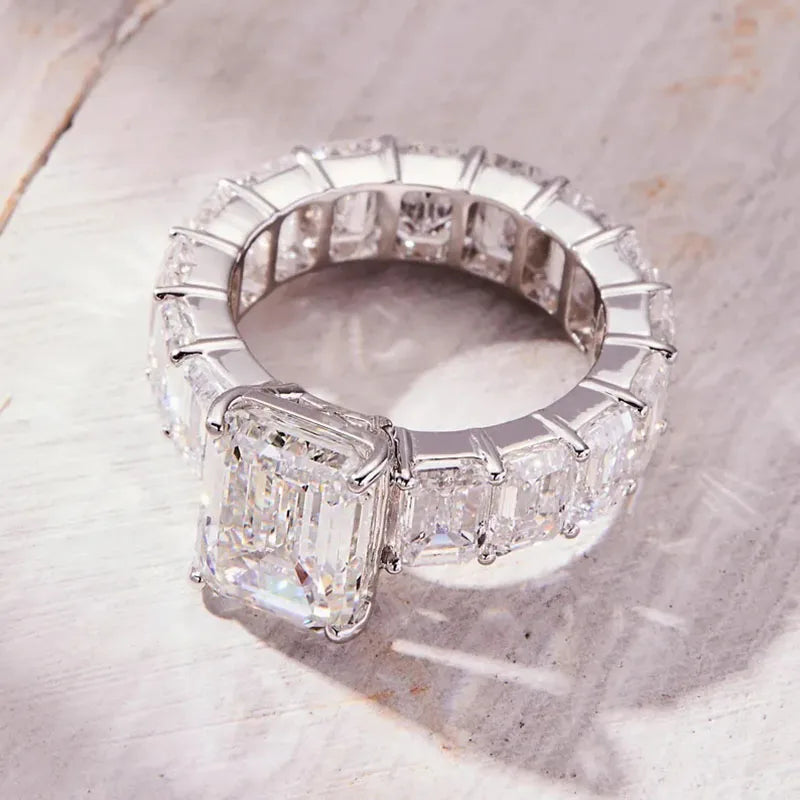 Gold engagement ring with emerald-cut diamond