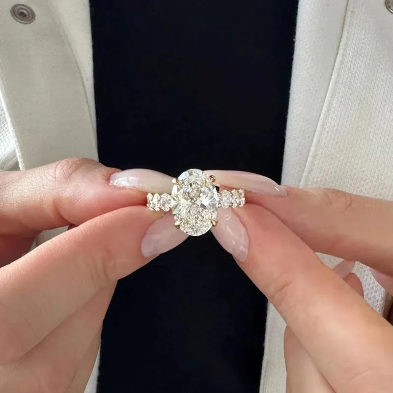 Gold oval diamond ring with accent stones