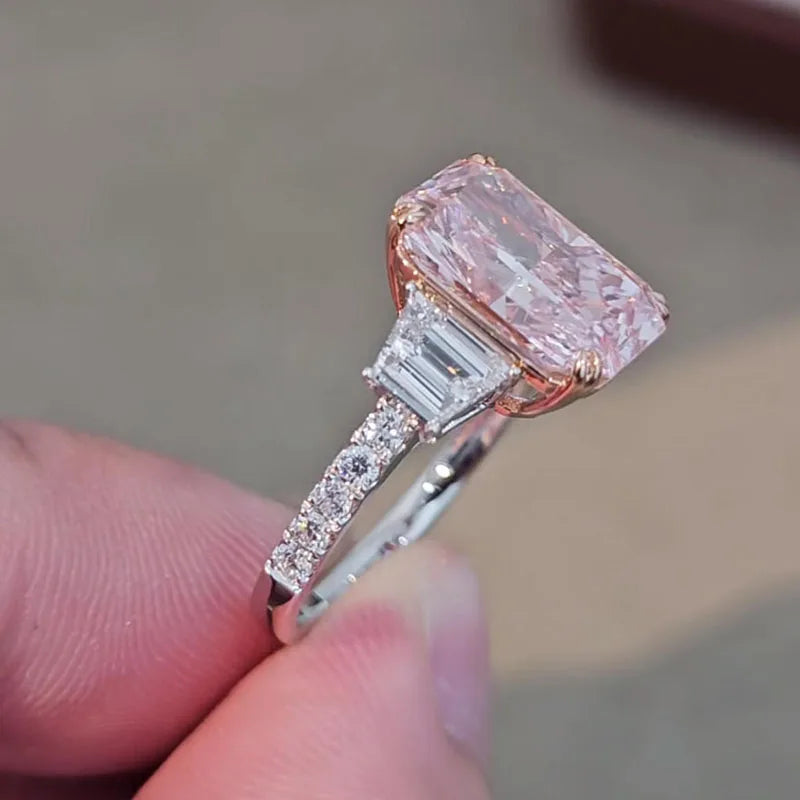 Radiant pink diamond ring with side stones