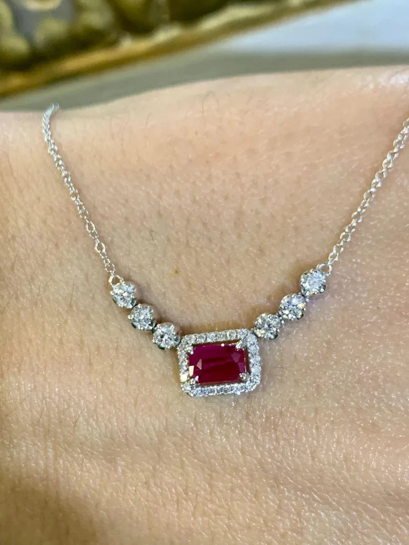 Ruby pendant framed by round lab-grown diamonds
