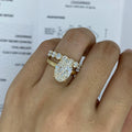 Oval-cut diamond ring paired with matching band