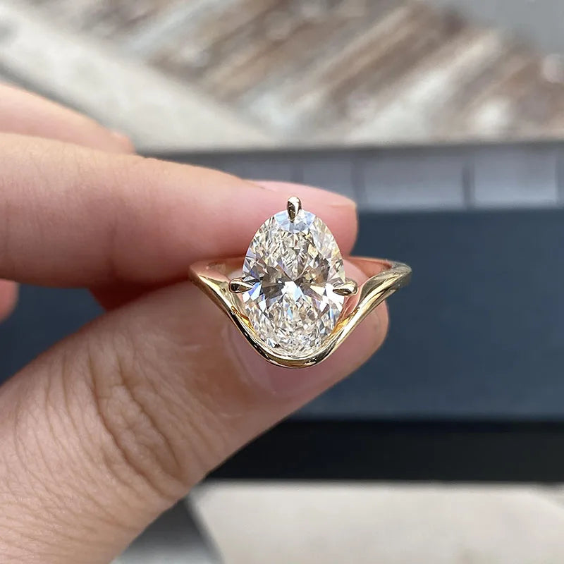 Gold ring with oval lab-grown diamond and twisted band