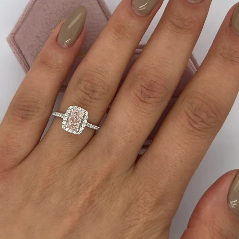 Radiant-cut pink lab-grown diamond with diamond halo