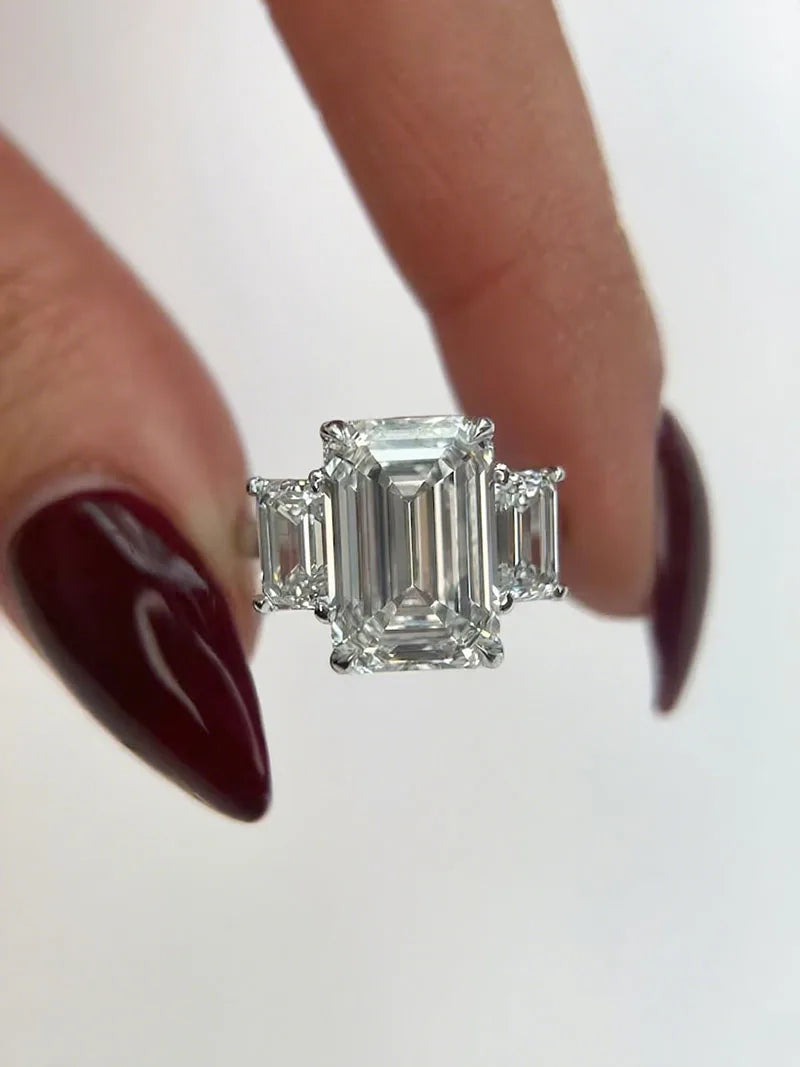 Large emerald-cut diamond ring with side stones