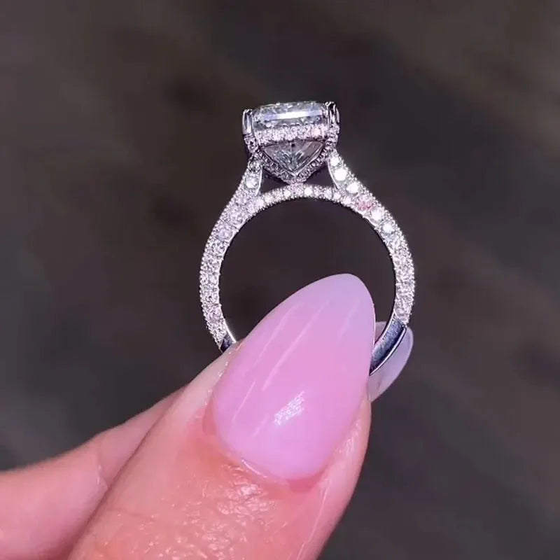 Gold radiant-cut diamond ring with pavé accents