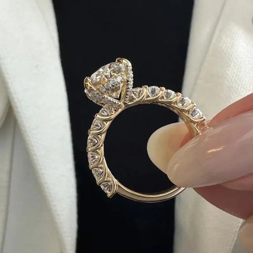 Oval lab-grown diamond ring with oval and round side stones