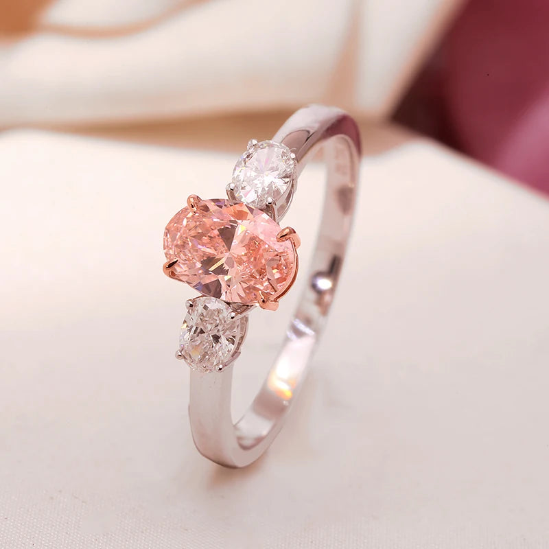 Gold ring featuring pink oval lab-grown diamond