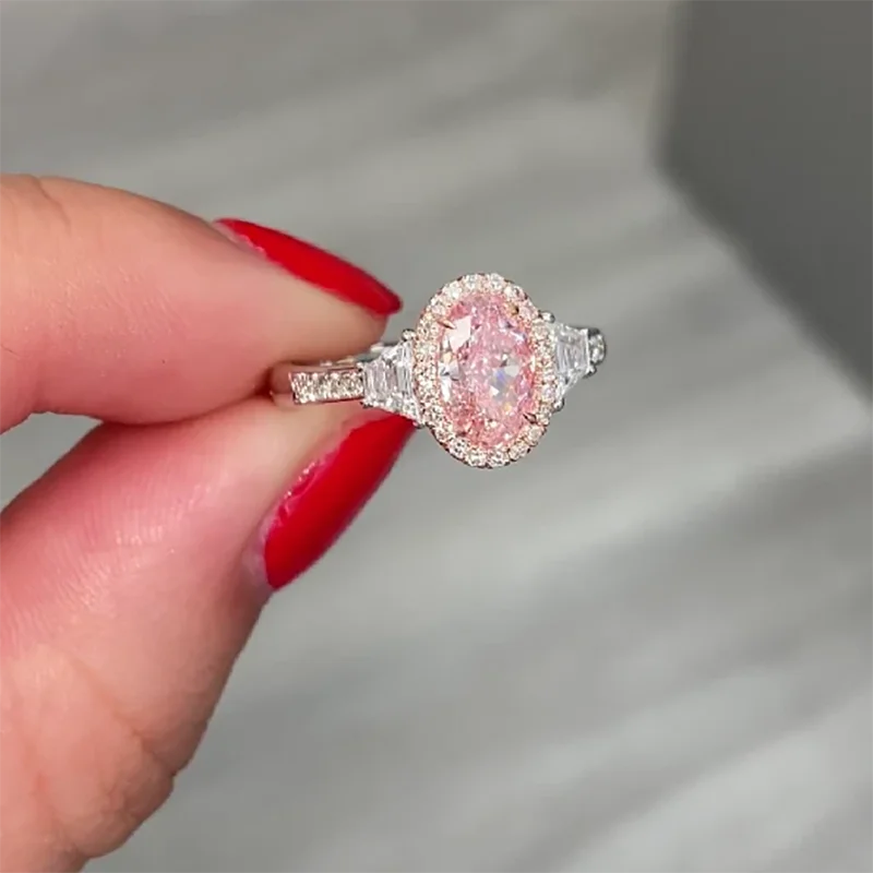 Two-tone gold pink oval diamond engagement ring
