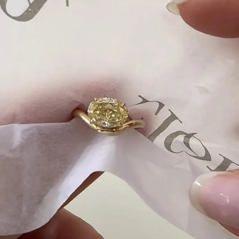 Lab-grown diamond ring with oval center and accent diamonds