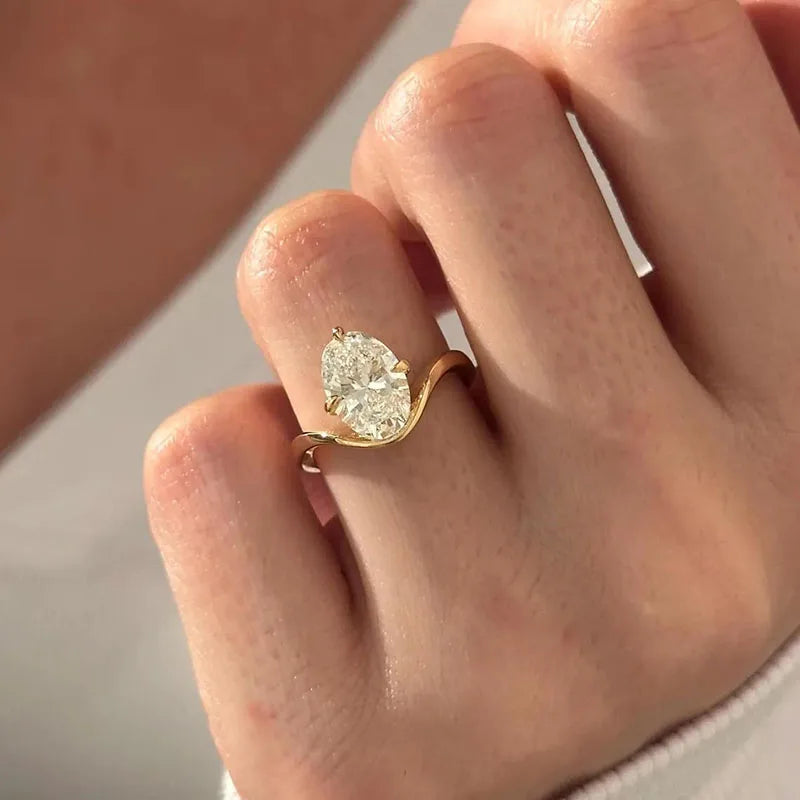 Oval lab-grown diamond ring with curved gold band