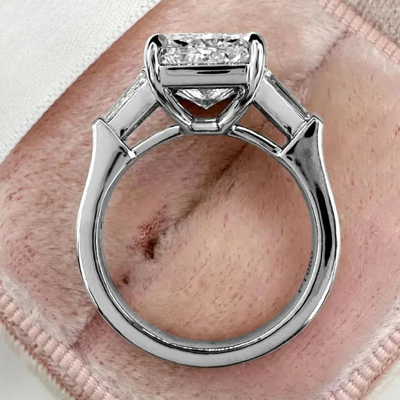 Prong-set radiant diamond ring with side stones