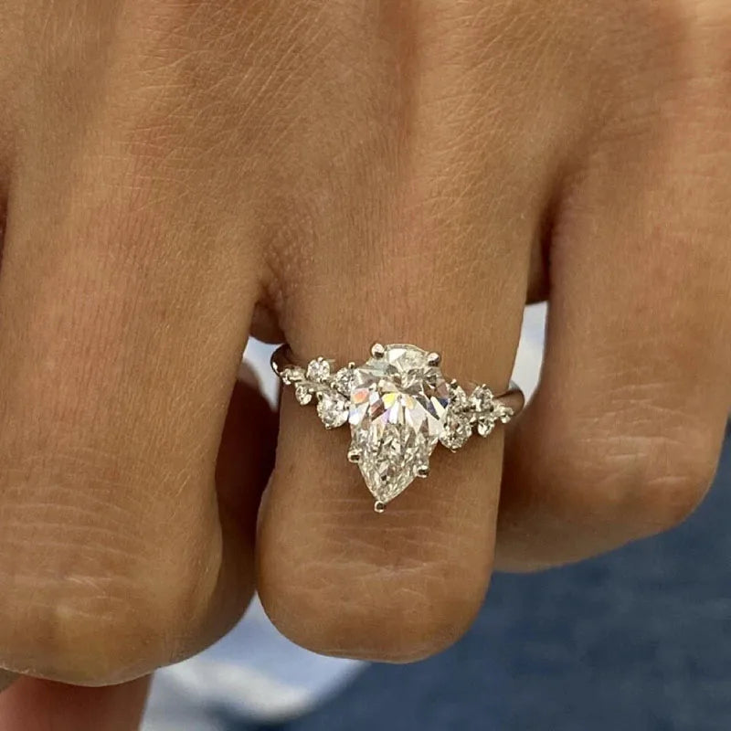 Pear-shaped diamond ring with delicate side accents