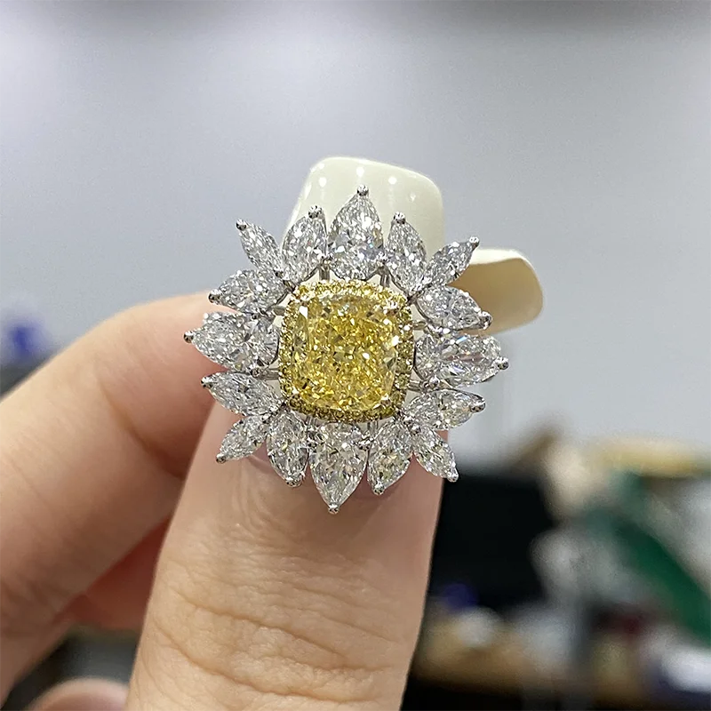 Gold engagement ring with yellow cushion diamond
