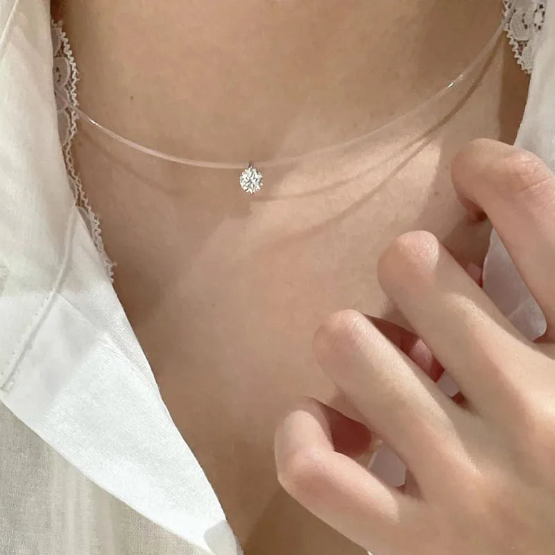 Floating round diamond necklace on transparent line
