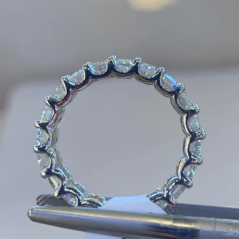 Gold eternity ring with radiant-cut diamonds