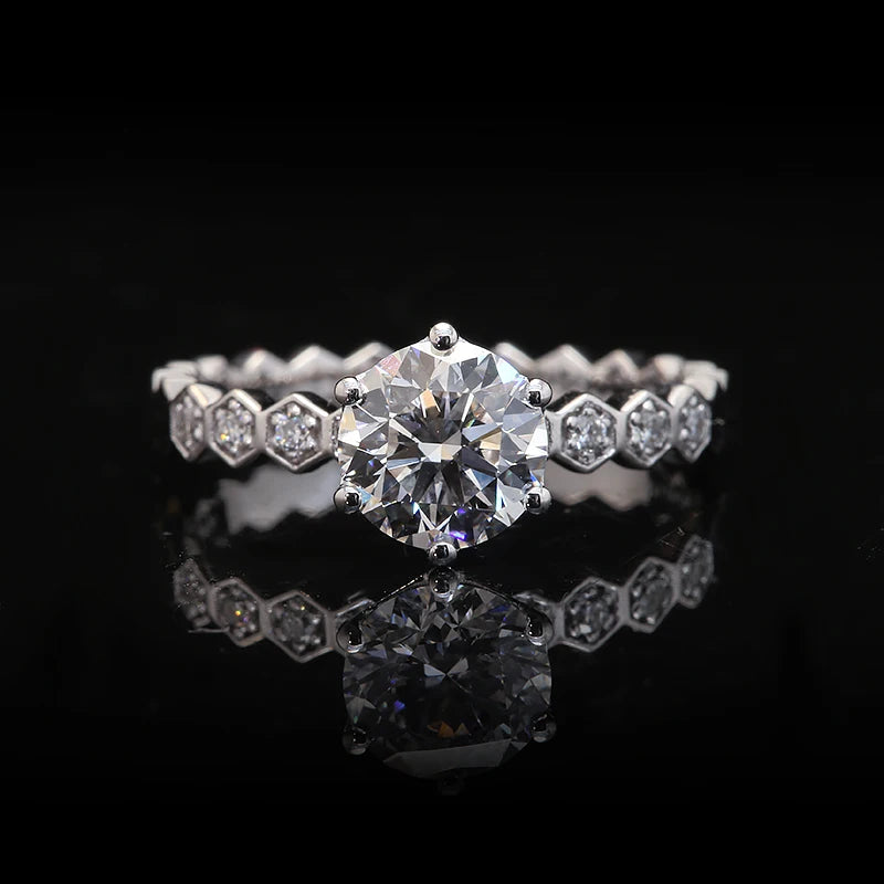 Round-cut diamond engagement ring with prong setting