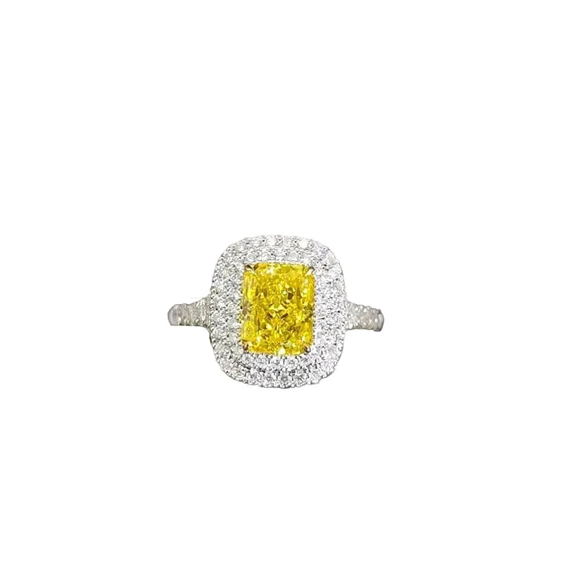 Yellow radiant-cut lab-grown diamond ring with diamond halo