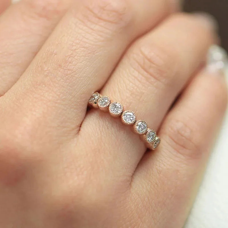 Round diamond stacking ring with bezel setting