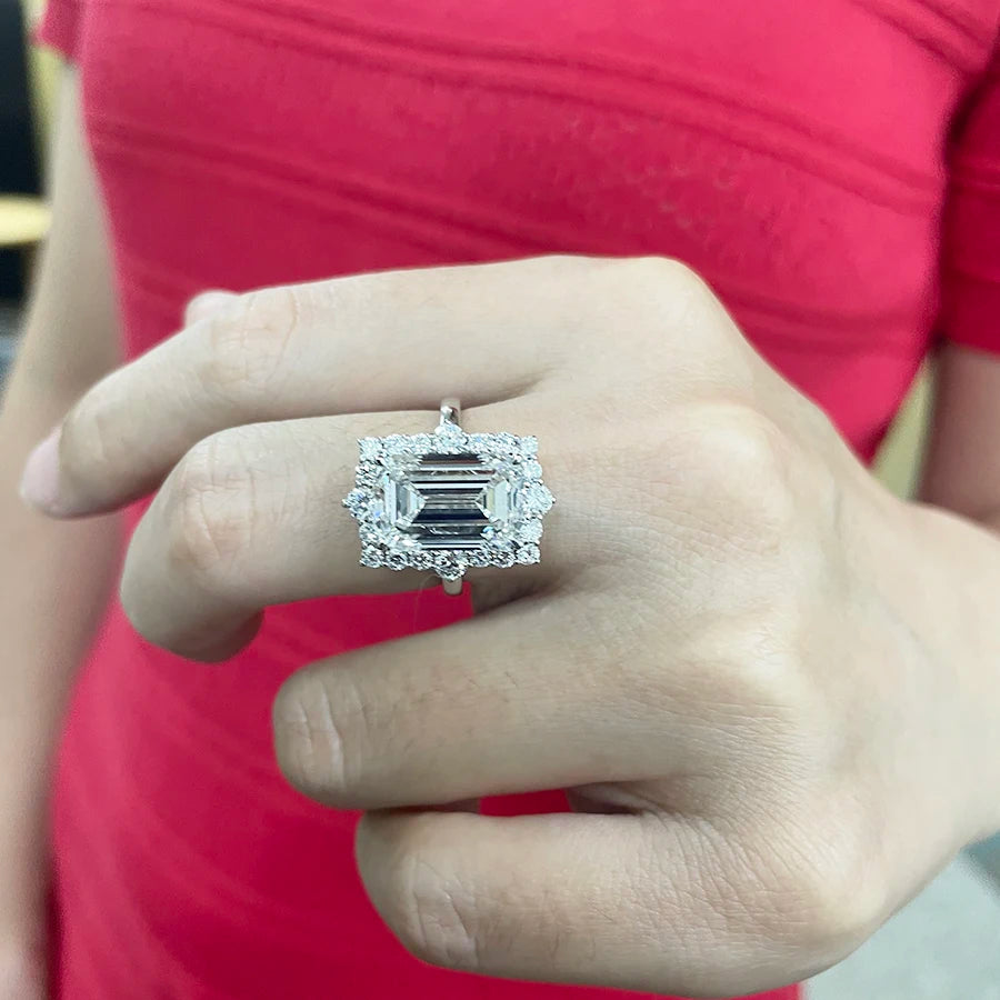 Lab-grown diamond ring with emerald-cut center and diamond accents