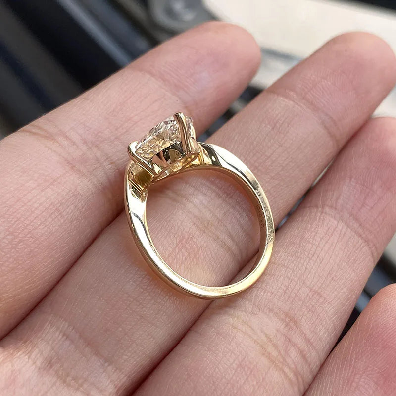 Oval lab-grown diamond ring with diamond accents and twist shank