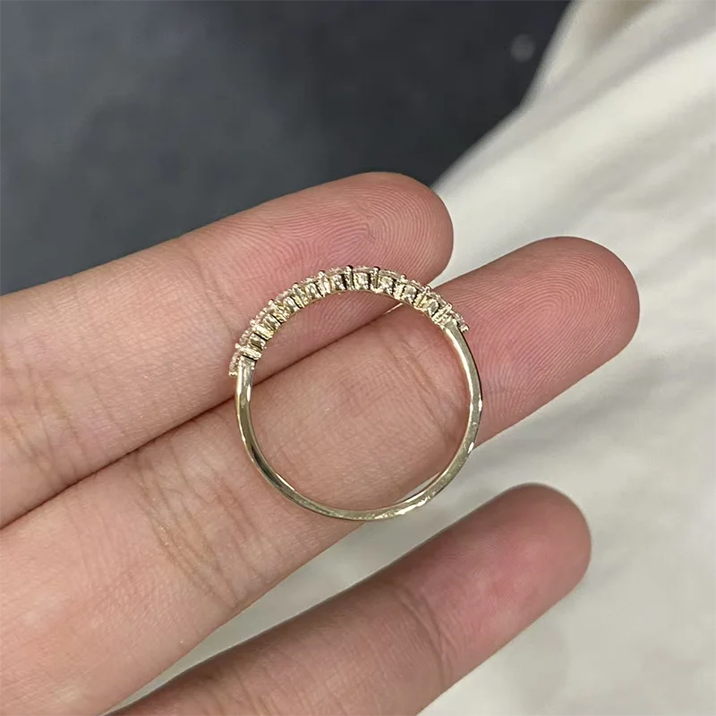 Chevron-style curved diamond wedding band