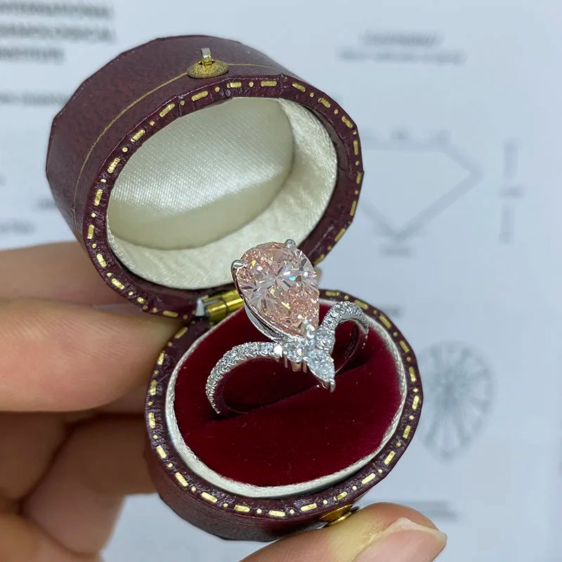 Gold ring featuring a pear-shaped pink lab-grown diamond