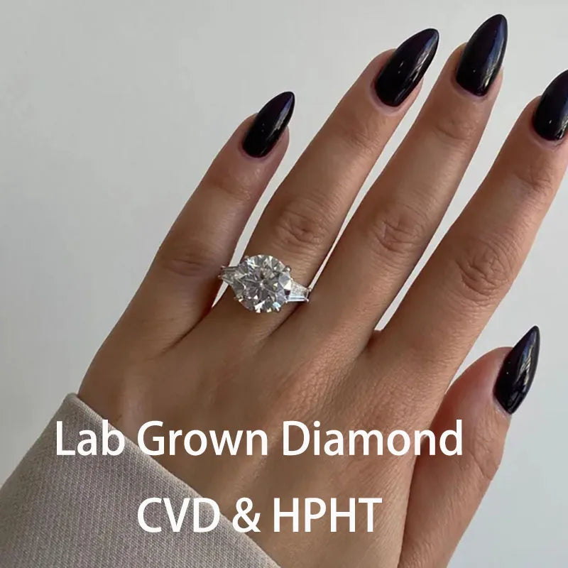 Round lab-grown diamond three-stone ring with tapered baguette side diamonds