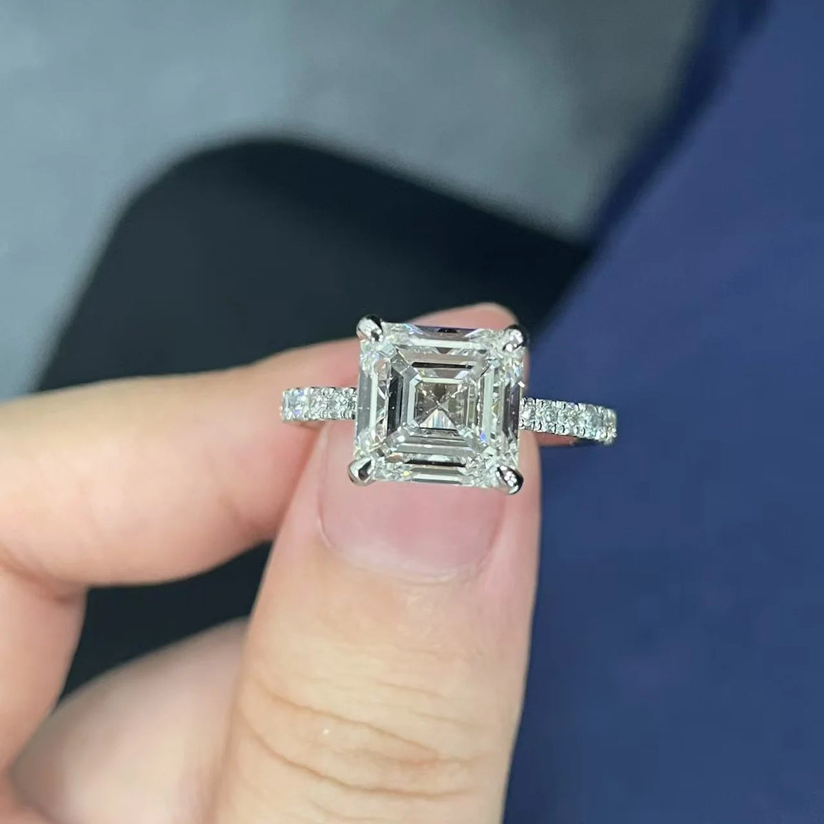 Gold ring featuring a large lab-grown diamond and accent stones