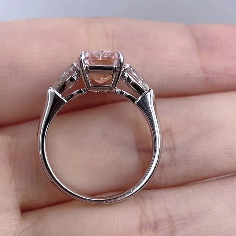 Fancy pink radiant diamond with two side diamonds