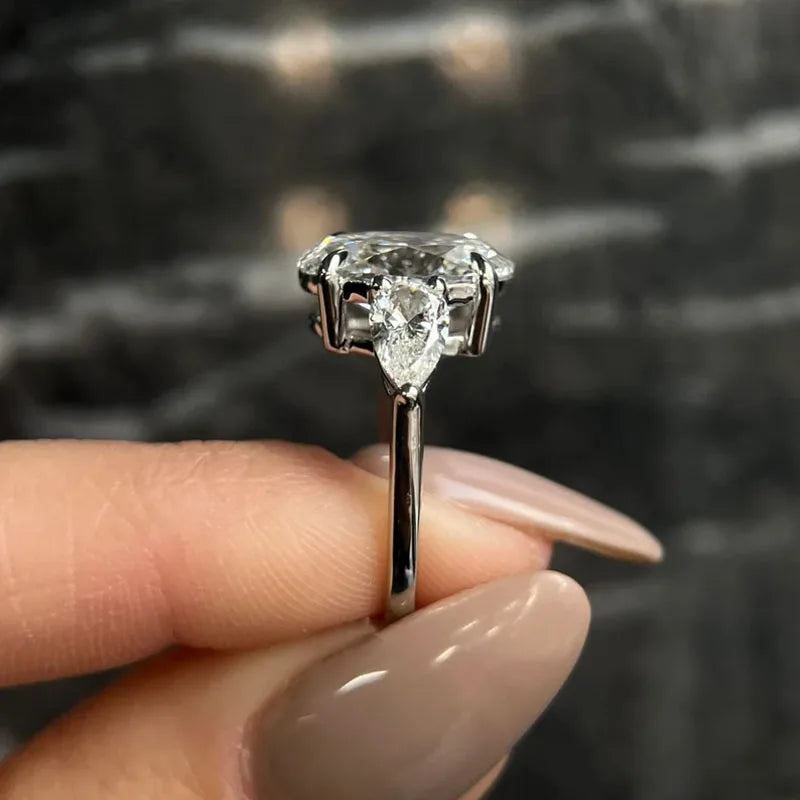 Gold three-stone engagement ring with lab-grown diamonds