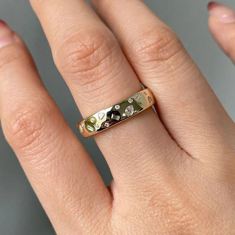 Contemporary flat inlaid diamond ring