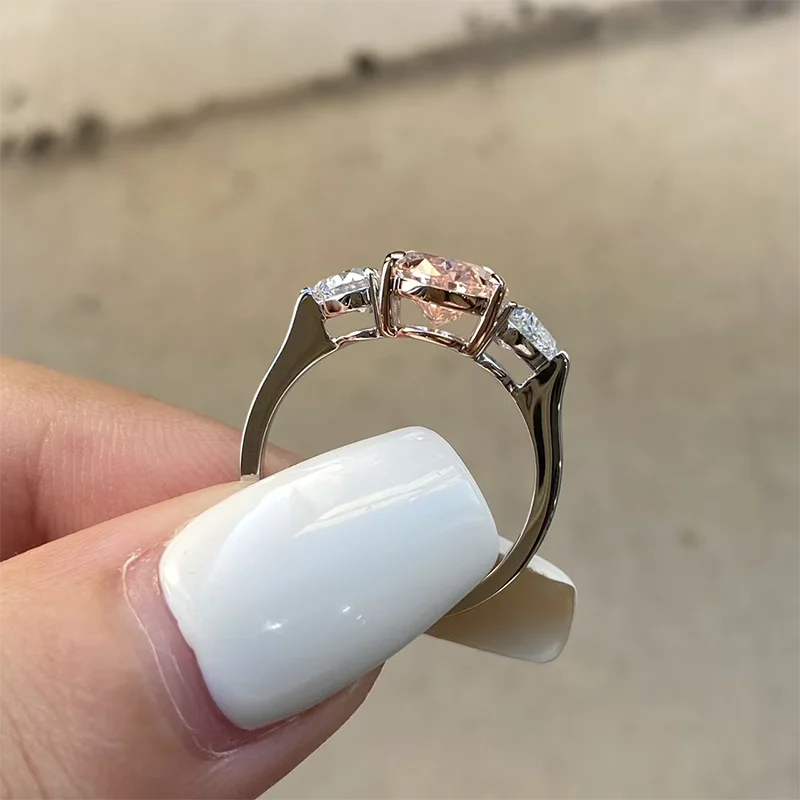 Fancy pink oval lab-grown diamond ring with heart accents