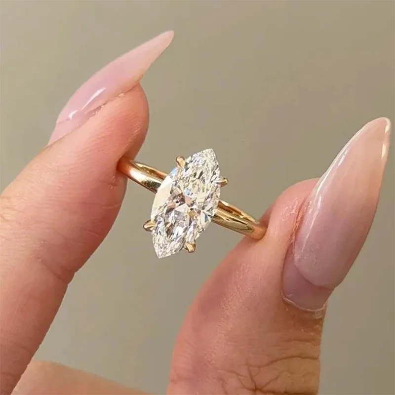 Prong-set marquise diamond engagement ring