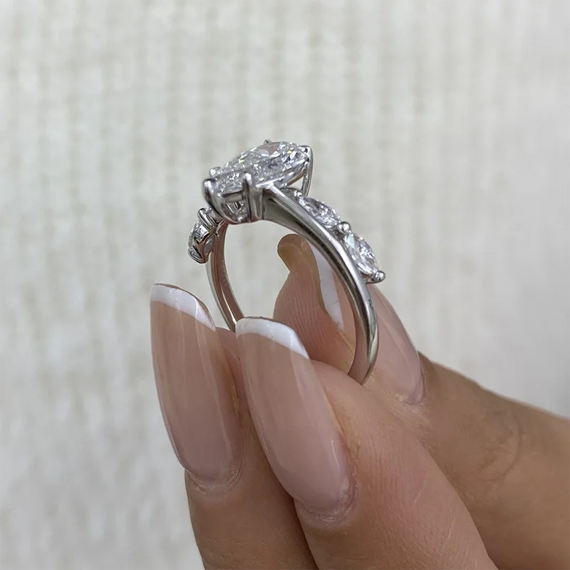 Pear-cut lab-grown diamond ring with marquise accents