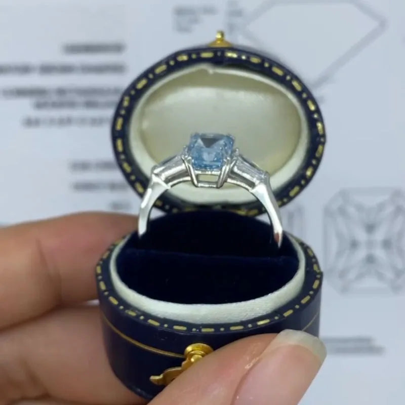 Prong-set blue radiant-cut diamond ring
