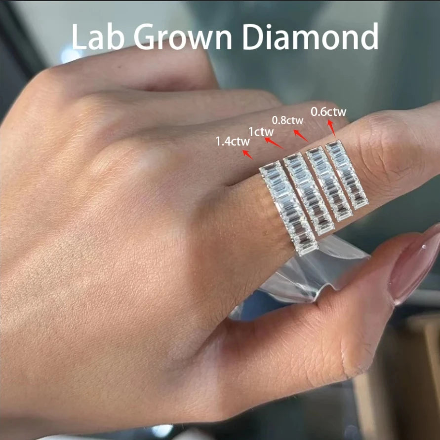 Gold anniversary ring with eight emerald-cut diamonds