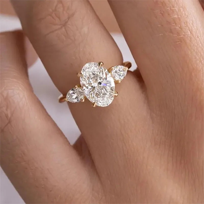 Oval and pear-cut lab-grown diamond three-stone ring