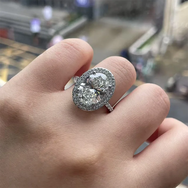 Five carat oval lab-grown diamond ring with accent diamonds