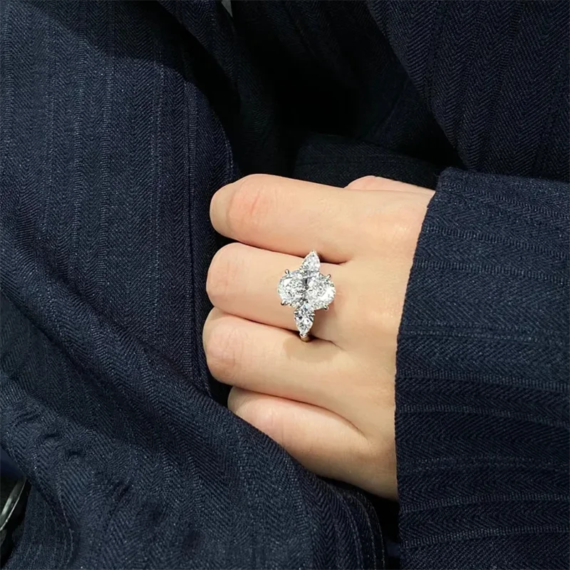 Three-stone lab-grown diamond ring with oval and pear cuts