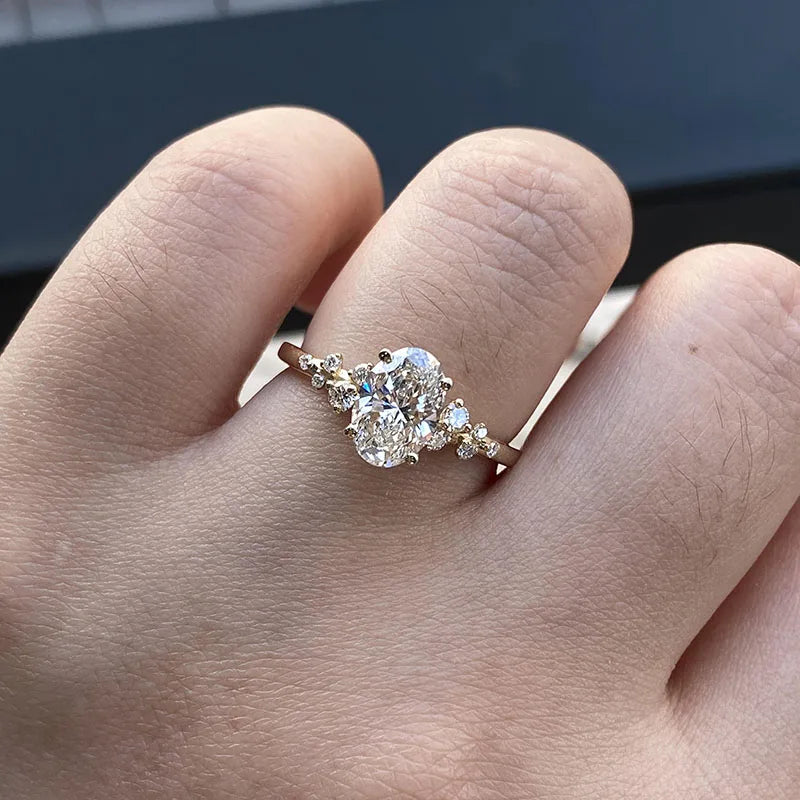 Oval-cut diamond ring with accent stones