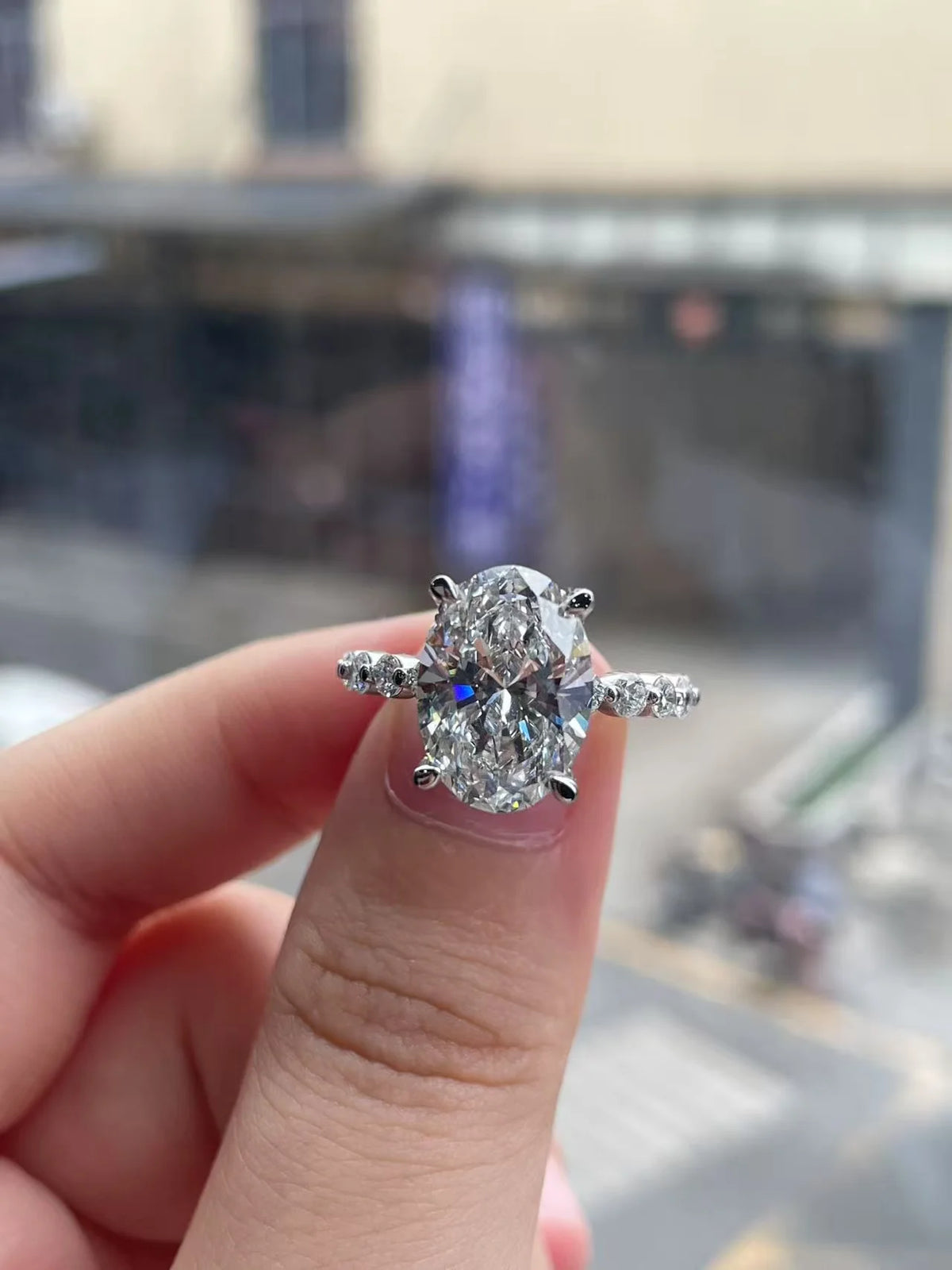 Oval-cut lab-grown diamond ring with accent stones
