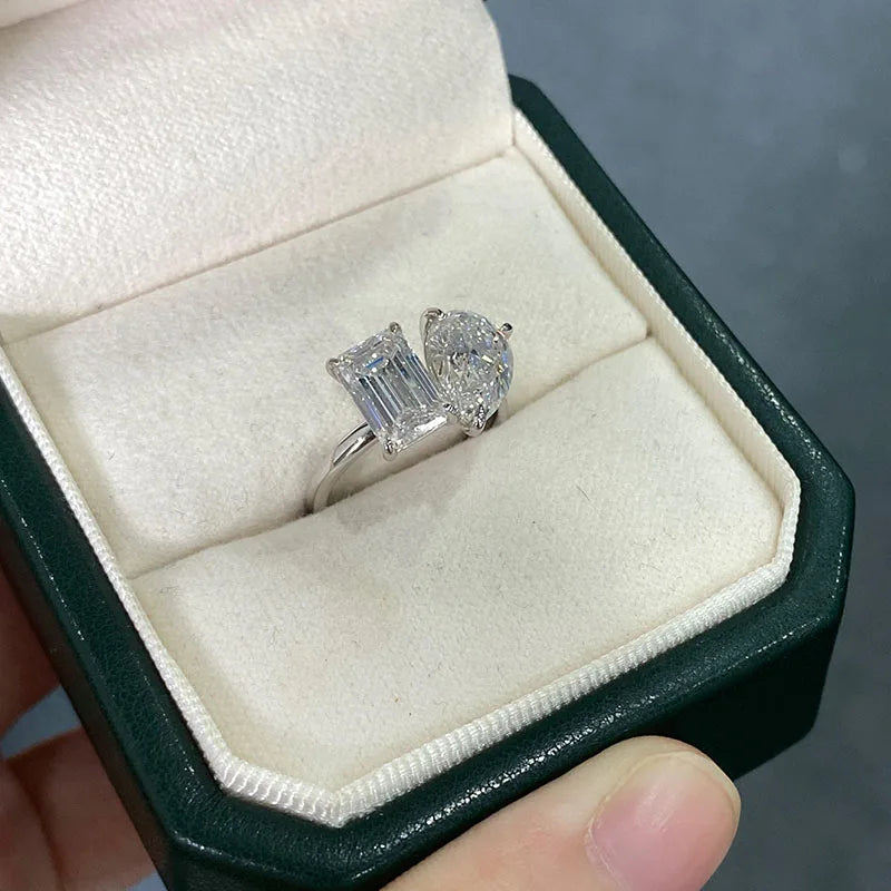 Emerald and pear diamond ring composition