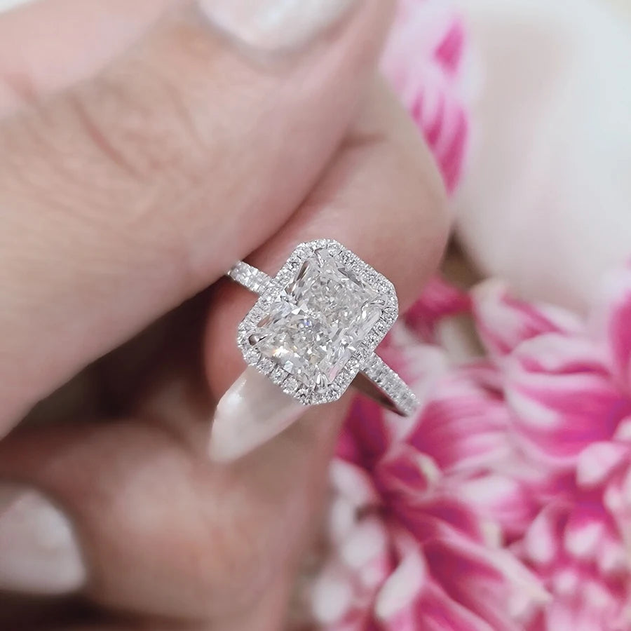 Radiant diamond ring with pavé accent stones