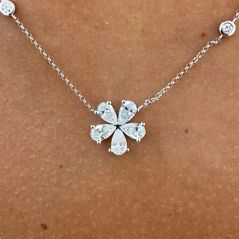 Round and pear diamond pendant necklace