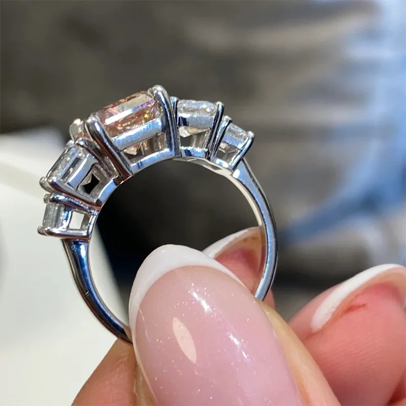 Radiant pink lab-grown diamond with emerald-cut side stones