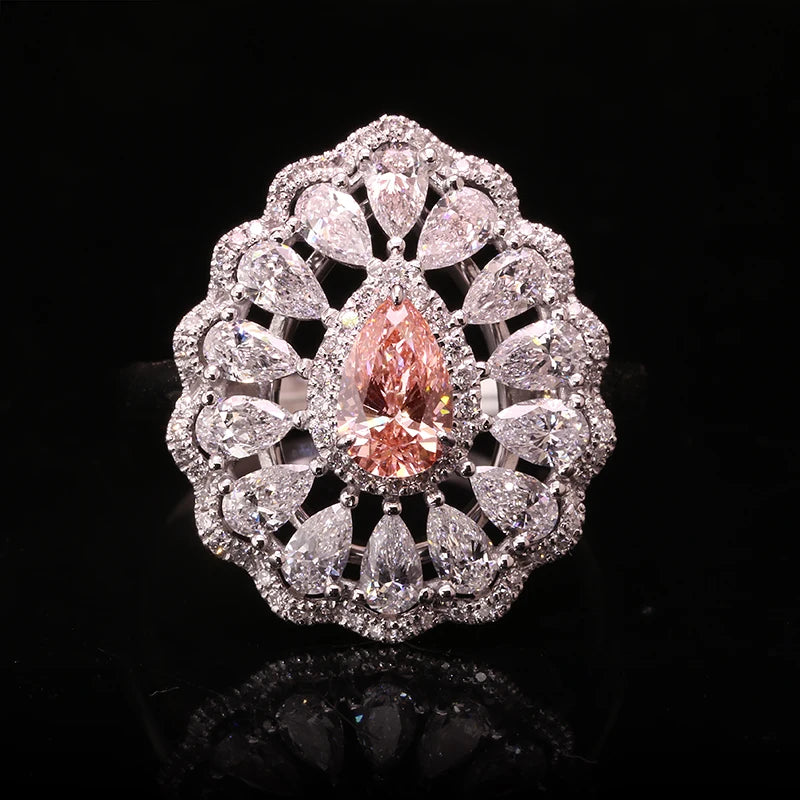 Pink pear-shaped diamond ring with lab-grown diamond accents