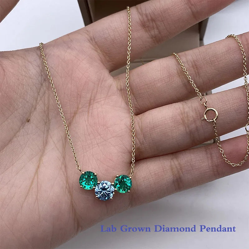 Blue round diamond pendant with emerald-cut side stones